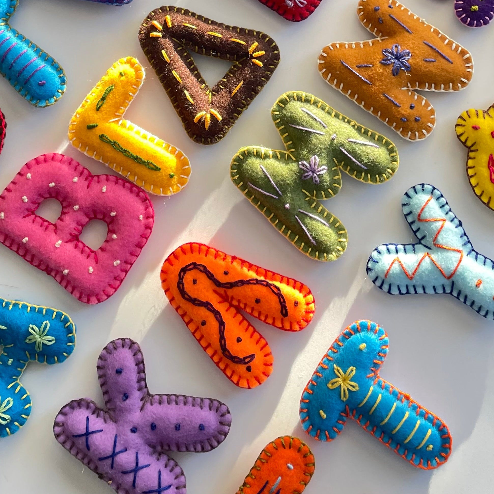 Colorful Greek alphabet letter toys on a white background